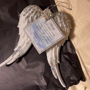 Angel wing ornament with rhinestones.
